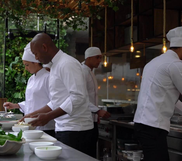 chefs working together to prepare a meal