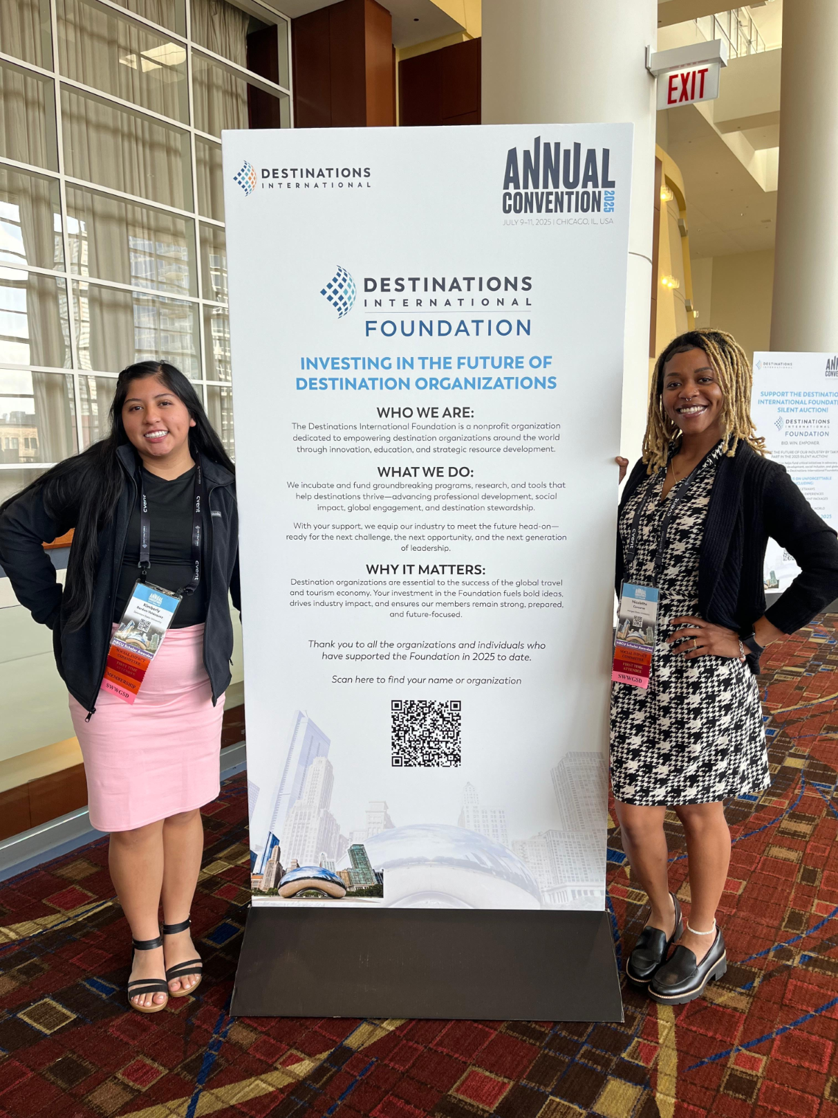 Two HBCU scholars pose in front of a sign at Annual Convention